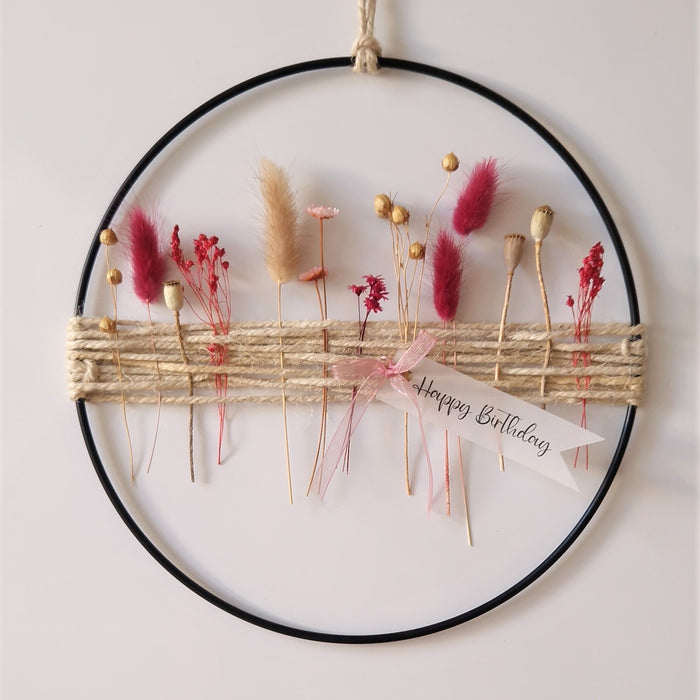Metallring mit pinken Trockenblumen
